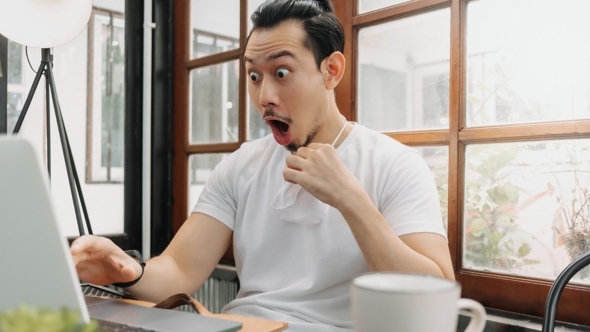 surprise man using laptop