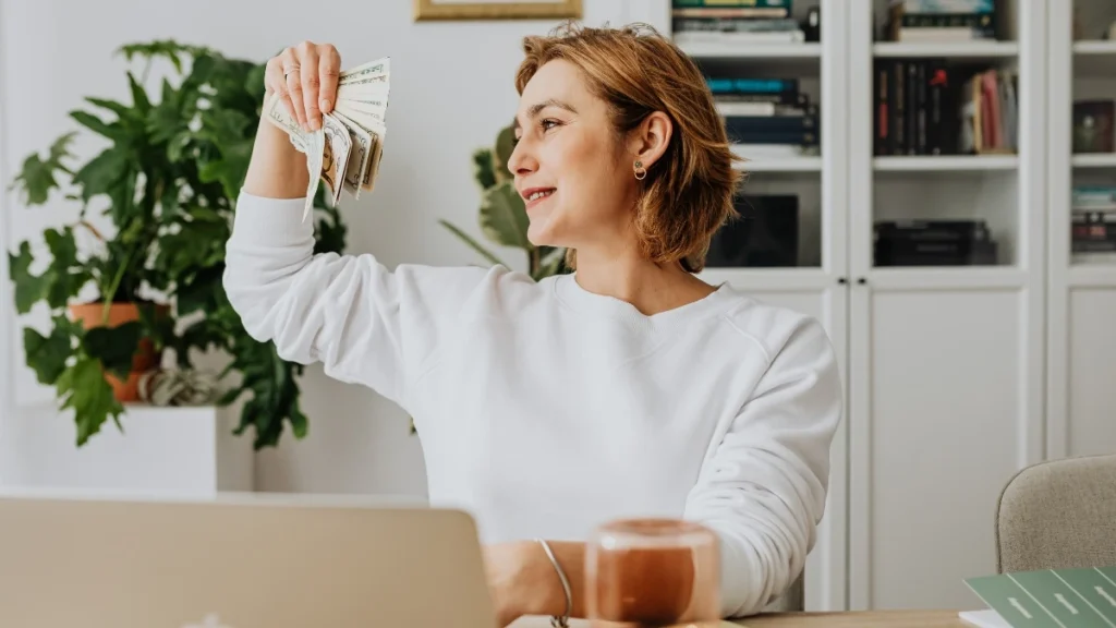 woman pick money on hand