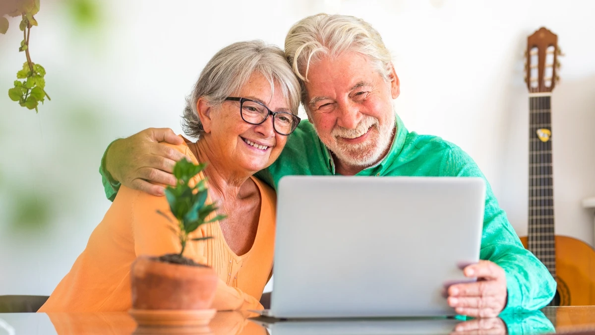 old couple using laptop