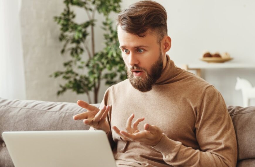 skocking man using laptop