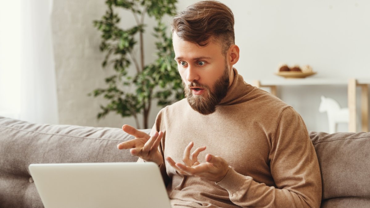 skocking man using laptop